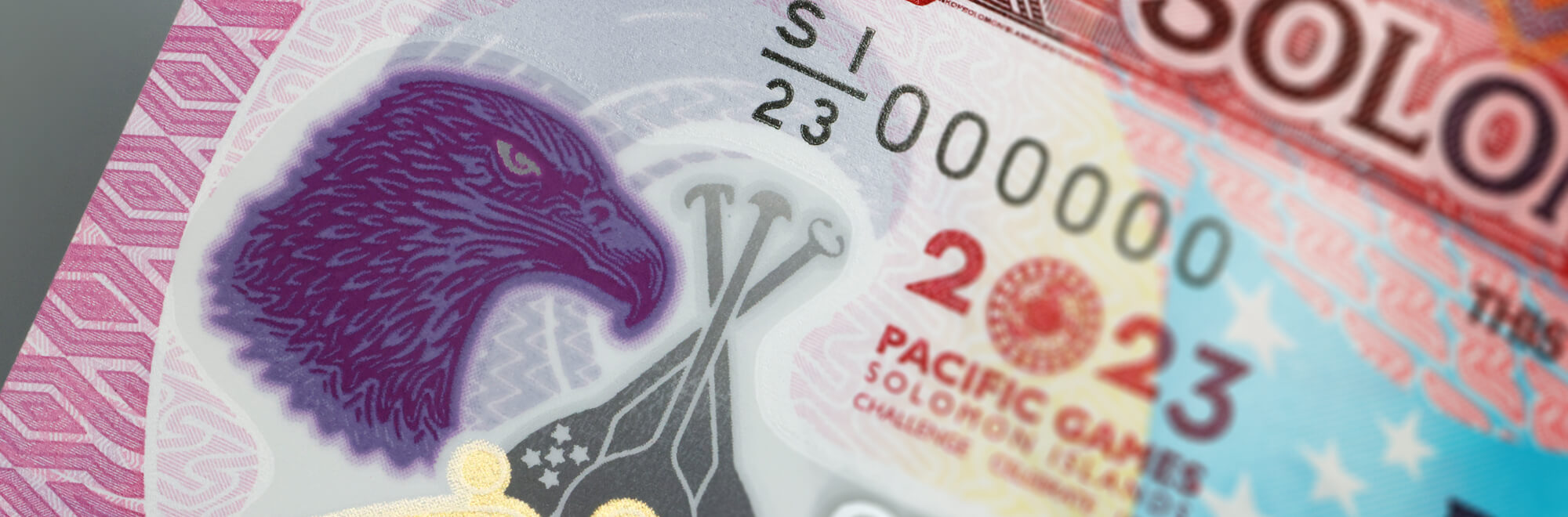a ten dollar Solomon Islands bank note featuring an ornate drawing of an eagle
